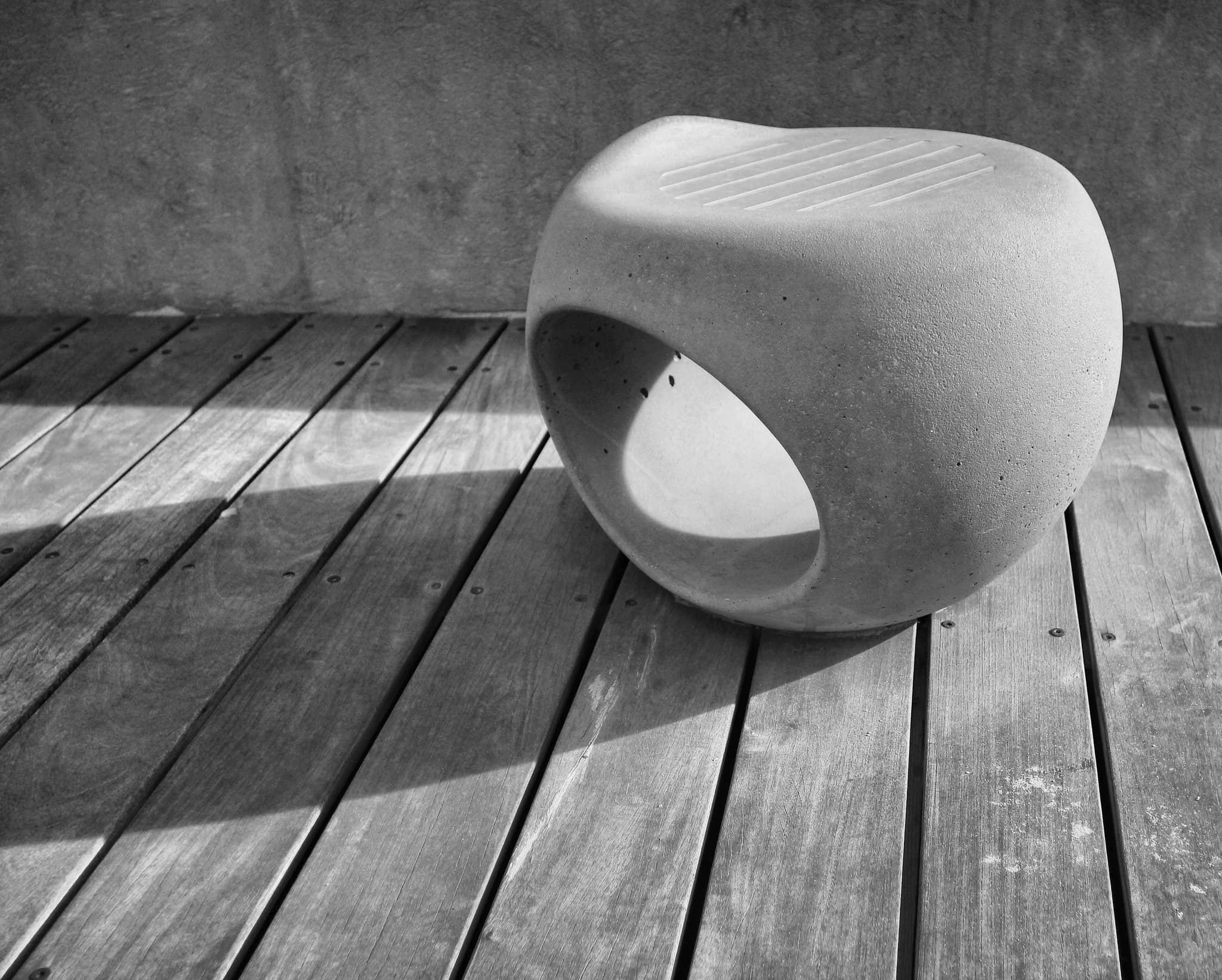 Geometric shadows on a concrete wall