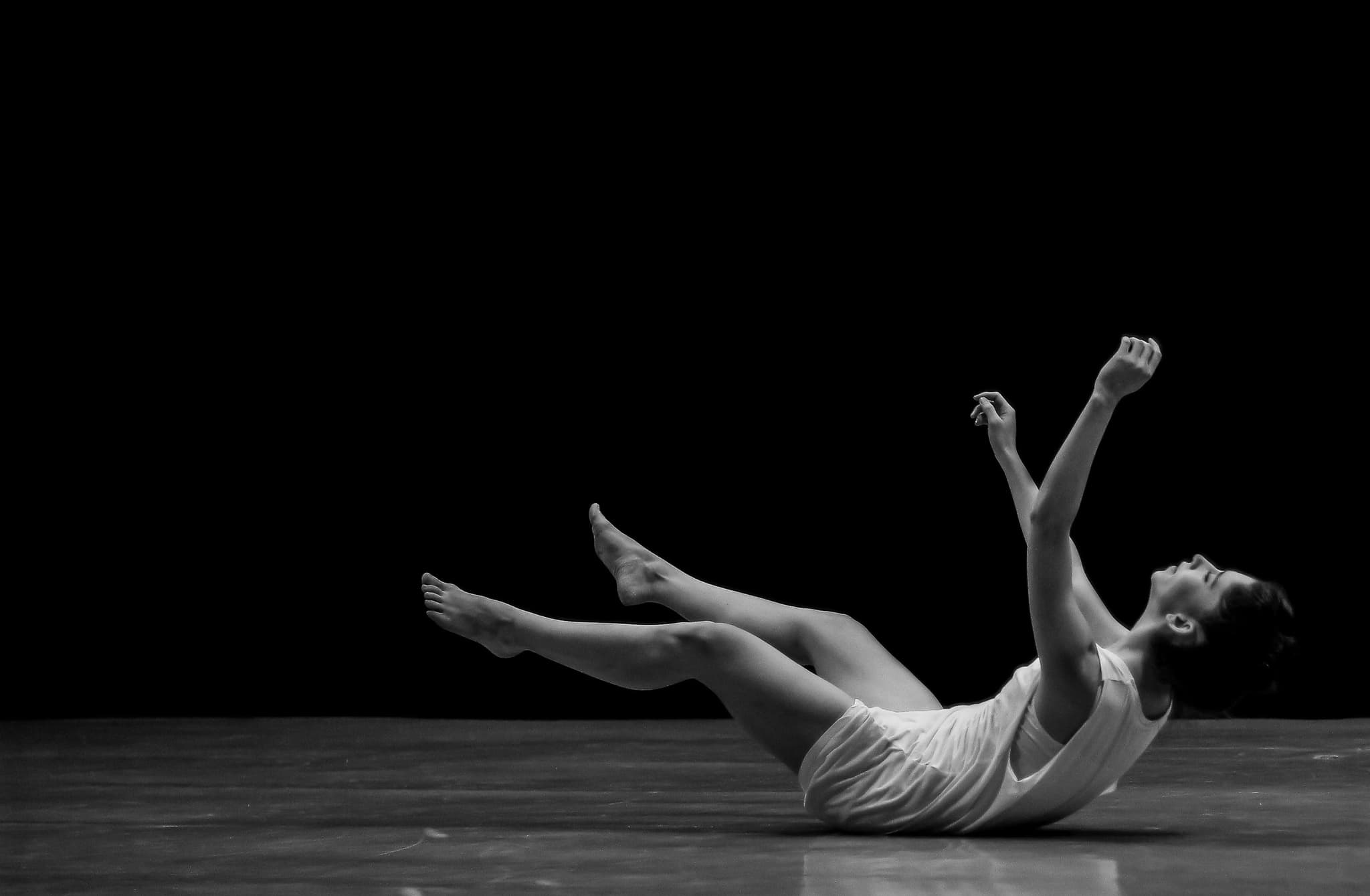 Dancer's silhouette against a spotlight