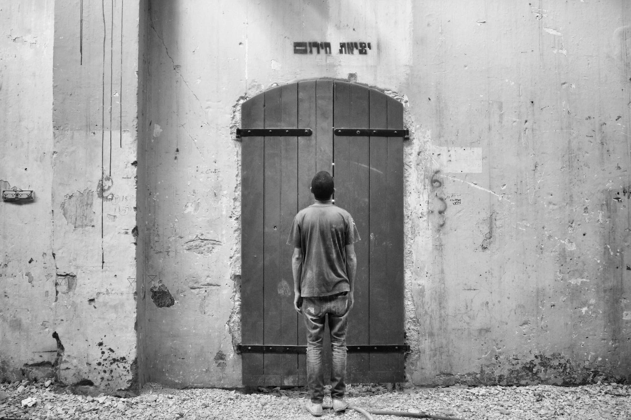 Hands holding an old film camera