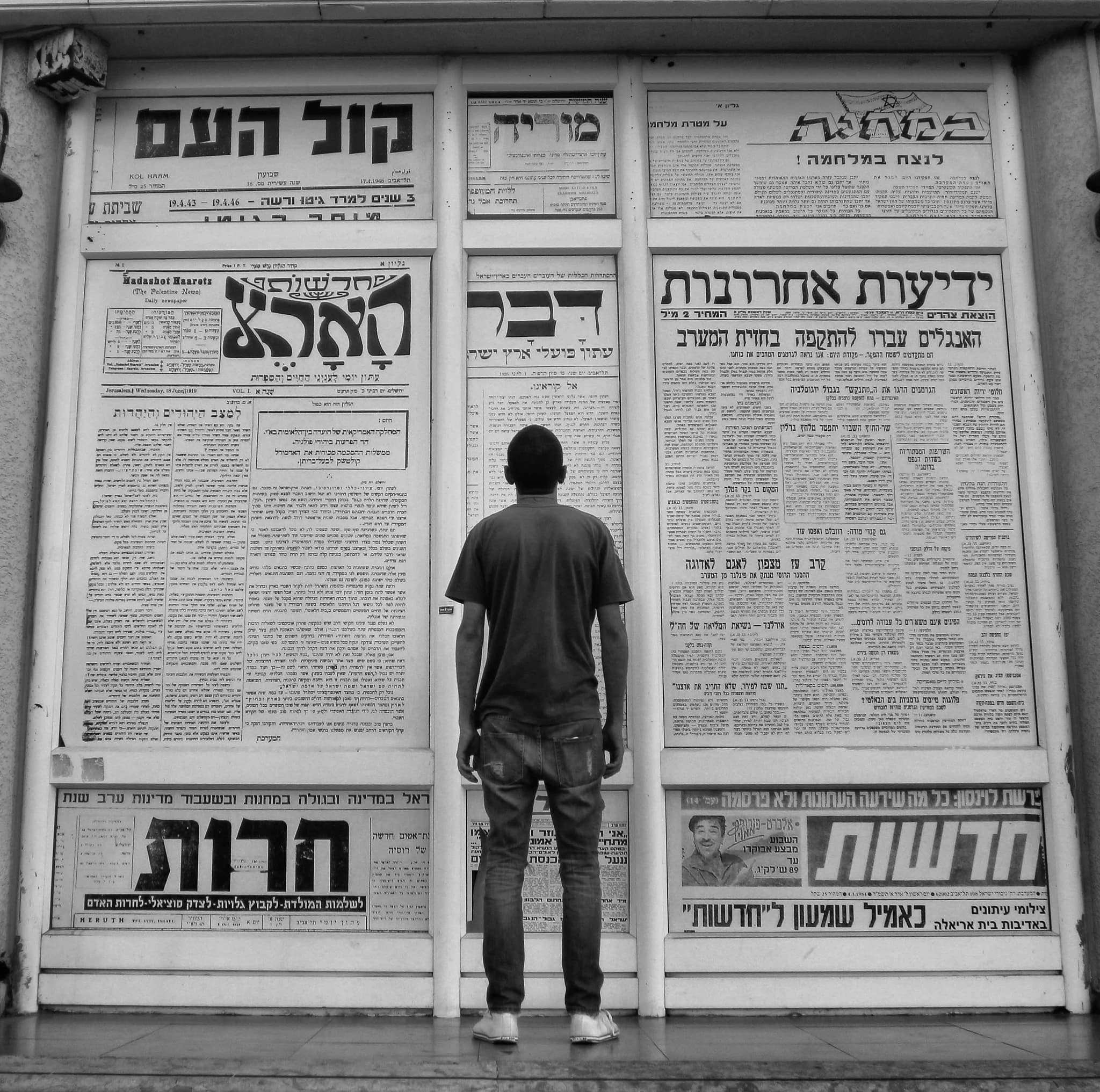 Hands holding an old film camera