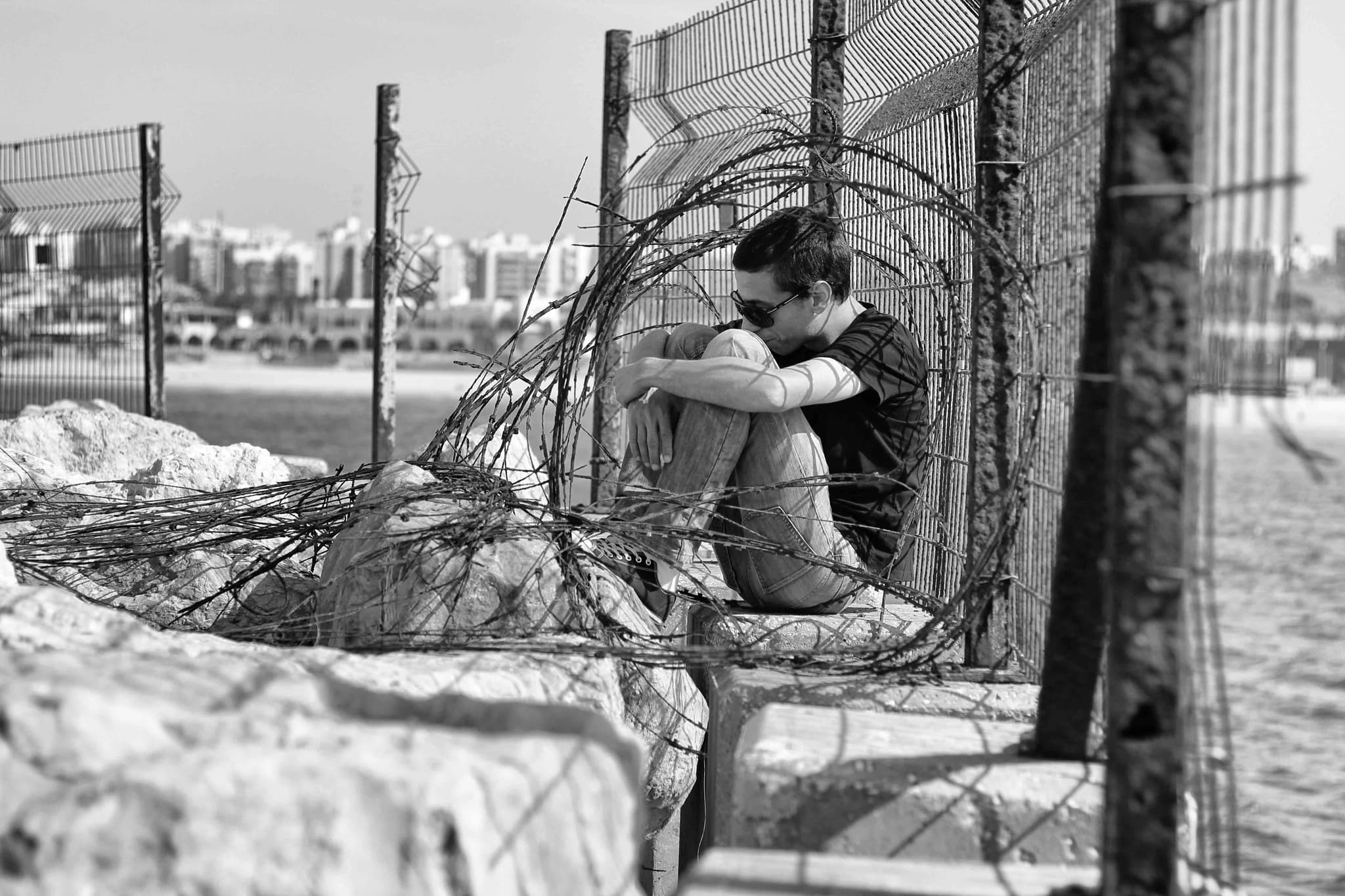 Hands holding an old film camera