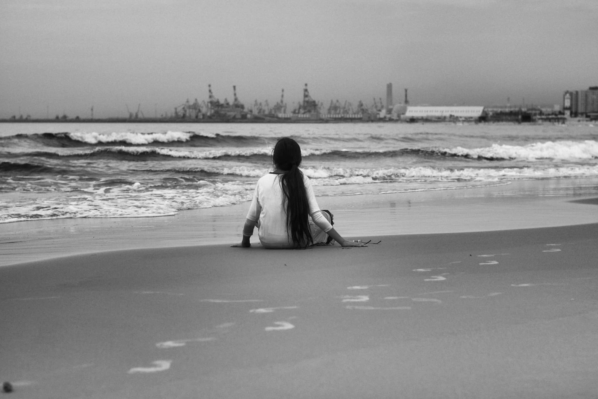 Waves retreating over pebbled beach